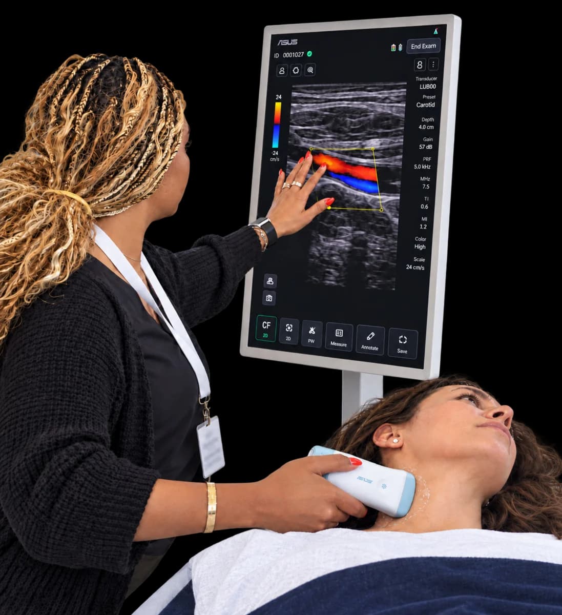 Clinician scanning a patient with a handheld ultrasound probe while the image shows on the rolling display beside the bed